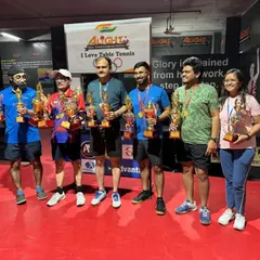 The winners from another successful corporate tournament, proudly displaying their trophies. I ensure a competitive environment for players from various companies.