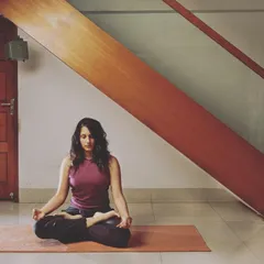 A calm moment of seated meditation in Padmasana, or Lotus Pose. This is the foundation for many mindfulness practices, including chanting. Understanding the components of a chant like OM, from its individual sounds to the silence that follows, transforms it from simple repetition into a profound meditative experience.