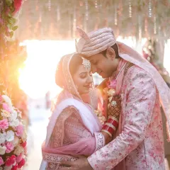 An intimate portrait of a bride and groom, their faces close together, bathed in the soft, warm glow of the golden hour. This photo highlights my focus on capturing tender, candid moments that feel both timeless and deeply personal.