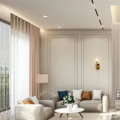 A bright and airy living space designed with a neutral color palette to maximize the feeling of calm. I used classic wall molding, sheer curtains to diffuse natural light, and a mix of textures in the furniture to add warmth and sophistication.