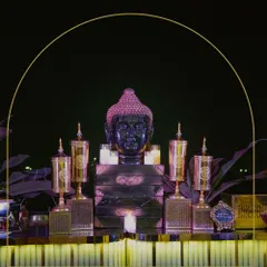 A serene and opulent setup featuring a Buddha statue as the centerpiece, surrounded by ornate golden urns and candlelight, creating a tranquil yet luxurious focal point.