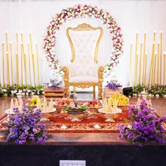 For this baby shower, we designed an elegant and serene stage with a throne for the mother-to-be. The floral ring and candle-lit backdrop created a warm, celebratory atmosphere, perfect for welcoming a new life.