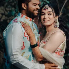 A lovely couple portrait from their Haldi ceremony. The bride's makeup is soft and natural, perfect for her floral lehenga.
