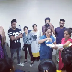 A doctor demonstrates the correct technique for applying a bandage during our first aid training.