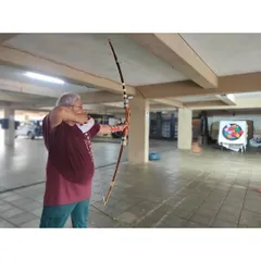 Age is no barrier to learning archery. This gentleman shows perfect focus as he prepares to release his arrow.