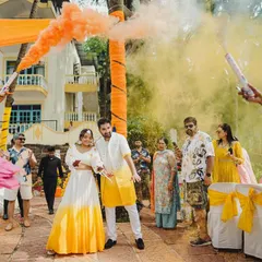 Making an entrance with a bang! The couple's entry was a high-energy affair with colorful smoke bombs and the infectious beats of dhol players, setting the tone for a fun-filled Haldi.