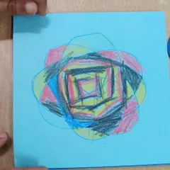 Using metal insets for drawing helps children refine the hand movements needed for writing. This piece shows a child's creative exploration with colors and overlapping shapes, demonstrating the freedom of expression we encourage.