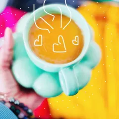 A cute, creative shot of a cup of chai with doodle hearts, part of the weekend flatlay series.