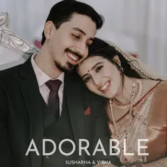 An "Adorable" moment between the couple. This is a slightly different angle from the same series, showing the consistency in capturing their genuine happiness.