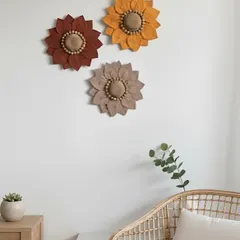Here, the macramé flower trio is styled in a cozy reading nook. Their texture and color add a point of interest to a simple white wall, complementing the natural materials of the furniture.