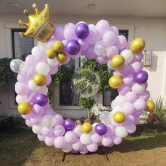 For this outdoor bridal shower, I used a color palette of lavender, purple, and gold balloons on a circular frame. A large gold crown foil balloon adds a playful and regal touch to the "Bride to be" theme.