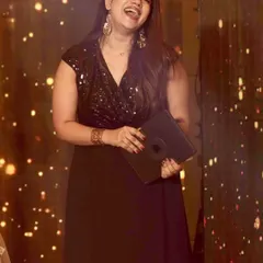 A candid moment of laughter on stage. Even during formal events, I believe in creating moments of genuine connection and joy.