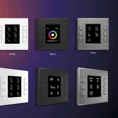 We offer a variety of finishes to match your home's aesthetic. This image displays our KNX wired keypad solutions in White, Black, and Grey, each featuring a clear display screen for intuitive control and status feedback.