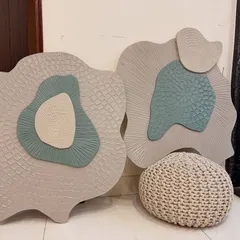 A pair of organically shaped artworks created on board. I used multiple layers and carving techniques to create distinct patterns, with the soft green adding a pop of color to the neutral tones.