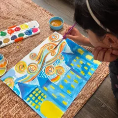 Adding her own creative flair with vibrant oranges and yellows to her 'Starry Night' inspired piece. I love seeing their personal interpretations shine through.