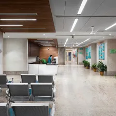 A hospital waiting area should be a space of calm, not anxiety. We achieved this through a clean, intuitive layout, warm materials like the wood-paneled ceiling, and soft, indirect lighting. The design minimizes clutter and noise, creating a serene environment that supports patient well-being from the moment they arrive.