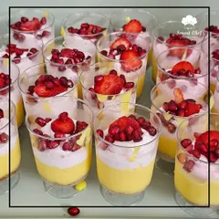 Elegant dessert cups filled with a creamy mango mousse and topped with fresh strawberries and pomegranate seeds. A light, refreshing, and beautiful dessert for any festive occasion.