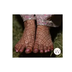 The beautiful dark stain of a bridal feet design, featuring a full jaal or net pattern.