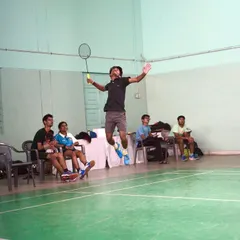 Capturing the peak of a jump smash. This explosive move is a key part of the advanced training we provide for competitive players.
