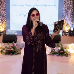 On stage, ready to host a 25th anniversary party. My job is to narrate the beautiful journey of the couple and celebrate it with all their loved ones.