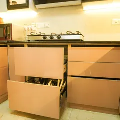 Another view of the deep drawer system, demonstrating its capacity and smooth operation. These drawers are a practical alternative to standard cabinets for storing heavy cookware and dinnerware.