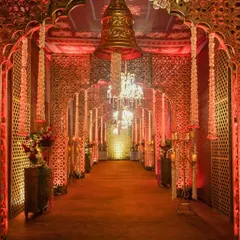 I designed this royal walkway with gilded jali panels, archways, and glittering chandeliers to make guests feel like they were walking through a palace of dreams.