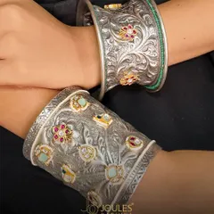 The Kada Touch. These handcrafted oxidized silver kadas feature detailed floral carvings and gemstone inlays, perfect for stacking or wearing as a single statement piece.