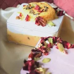 A close-up of the Rasmalai Tres Leches tub, showing the rich, creamy texture and the beautiful toppings.