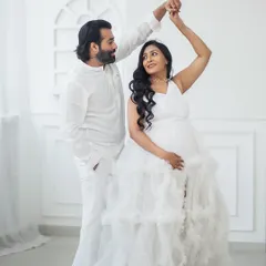 A gentle dance, a shared smile. These are the unscripted moments of joy I love to capture for expecting couples.