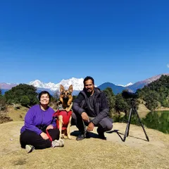 A family portrait with our dog Jiraiya during a trip to Chopta, with the Himalayan peaks creating a breathtaking background. These pet-inclusive vacation sessions are my specialty, capturing your whole family on your greatest adventures.