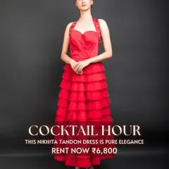 The 'Cocktail Hour' calls for pure elegance, like this red tiered dress by Nikhita Tandon. Its vibrant color and flattering silhouette make it a perfect rental for a glamorous evening party.