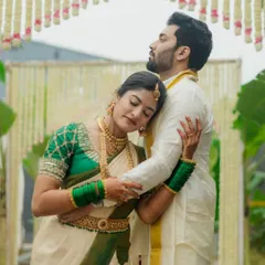 An embrace that speaks volumes. This portrait of a Coorg couple showcases their deep connection, with the bride resting her head on the groom's shoulder in a moment of peace.