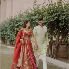 A candid moment of a couple walking and talking. The natural smiles and easy stride capture the comfortable and joyful connection they share, making for a beautiful, relaxed portrait.