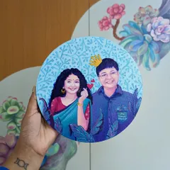 An example of a personalized couple portrait painted on a round canvas. I work from photos to capture likenesses and personalities, surrounding the subjects with foliage and patterns to create a truly unique piece of art celebrating their relationship.