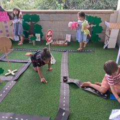 We created a miniature town to learn about our community. Through this imaginative role-play, children explore different jobs, learn to navigate roads safely, and practice collaboration, all while having a wonderful time driving their toy cars through the city they helped build.