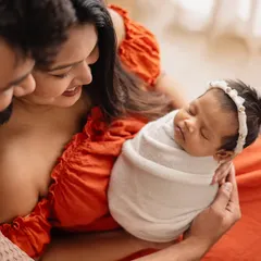A classic family portrait with your newborn wrapped snugly in your arms. I love the way this image focuses on the three of you, creating a memory of your first days as a new family.