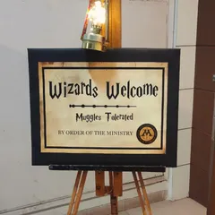 The adventure begins here. We set the scene with themed welcome signs and decor to transport your guests to a magical school of science and sorcery.