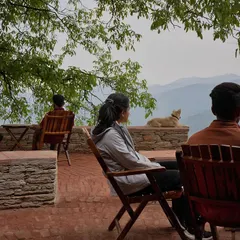 Visitors enjoying the panoramic valley views from the Sargakhet Handicraft Centre. The design seamlessly blends indoor and outdoor spaces, creating a memorable experience that promotes sustainable tourism.