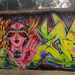 A full view of a collaborative mural, blending my figurative style with classic graffiti lettering. This piece shows how different artistic elements can come together on a single wall to create a complex, vibrant narrative.