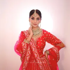 A close-up of the stunning jewellery and detailed blouse of our pink bridal lehenga. We provide complete sets like this so your portfolio looks polished and professional.