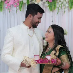 A sweet moment between the couple during the ring ceremony. Her makeup remains flawless, capturing her joyful expression.