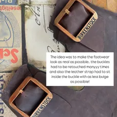 A close-up of the finished installation, showing the custom-made wooden buckles and the texture of the real leather strap. The goal was to make it look as realistic as possible.