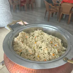 A glimpse of a school catering event I handled. This is a large serving of my flavorful Veg Fried Rice, kept hot and fresh in professional chafing dishes. My service is perfect for large gatherings, ensuring everyone gets a delicious, well-prepared meal.