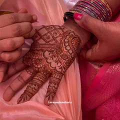 Every stroke matters. This image captures the careful application of a complex pattern on the palm, showcasing the fine lines and shading techniques that I teach in my classes.