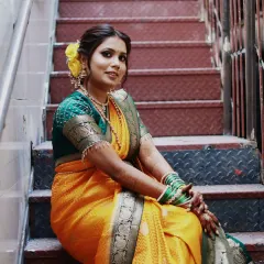 I love creating the perfect Maharashtrian bridal look. Here, I focused on a soft, glowing base to let her natural beauty shine, paired with a classic hairstyle and beautiful yellow flowers. This look is ideal for a traditional wedding ceremony.