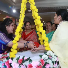 Family members participating in the cradle ceremony, a beautiful tradition filled with smiles and community spirit.