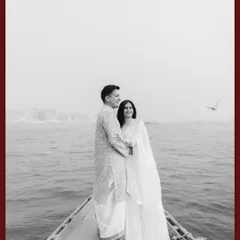 A timeless black and white portrait of Kapil and Ritika on a boat in Varanasi, capturing a quiet moment on the sacred Ganges.