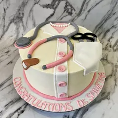 An apple a day keeps the doctor away, but a doctor cake is for a special day! I designed this cake to look like a doctor's coat, complete with a fondant stethoscope, to celebrate a medical school graduation.
