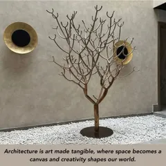 Architecture is art made tangible. In this space, a sculptural metal tree becomes a captivating focal point, its organic form contrasting with the smooth wall and geometric art pieces. It is a harmonious fusion of artistry and nature.