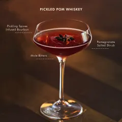 Our bestselling Pickled Pom Whiskey. It features a pickling spice-infused bourbon, balanced with a pomegranate salted shrub and a hint of mole bitters.